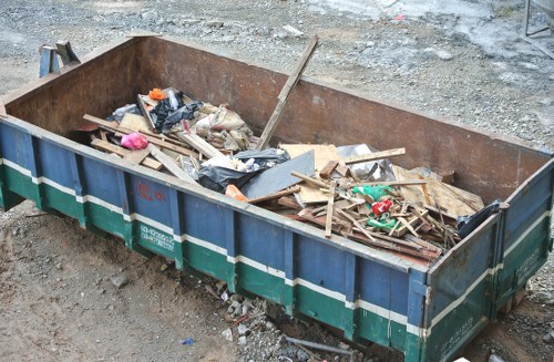 Front view of a residential garden with cleared waste awaiting collection